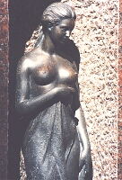 
   small bronzen statue   
    on a private grave   
